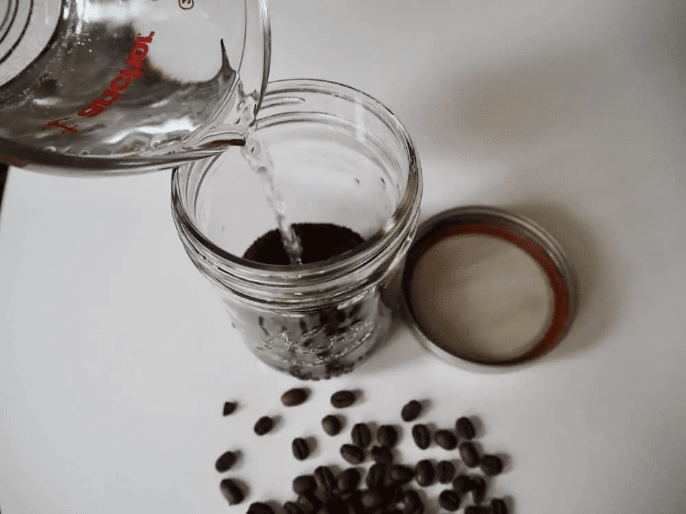Add water to cold brew grounds